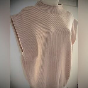 Sleeveless, mock neck sweater
